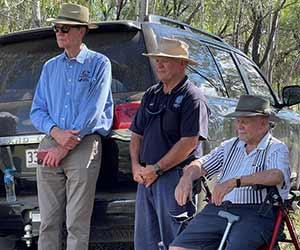 Image (left): Sir Angus Houston, Ronnie and Uncle Kevin Waters watch the welcome to country smoking ceremony and didgeridoo performance at Munya Lake near St George.
