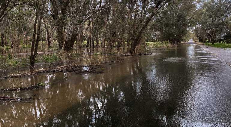 Water over the road from Reedy Creek in Carraragarmungee, near Wangaratta in Victoria.
