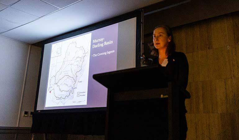 Associate Professor Emily O’Gorman presenting her research at the symposium dinner.